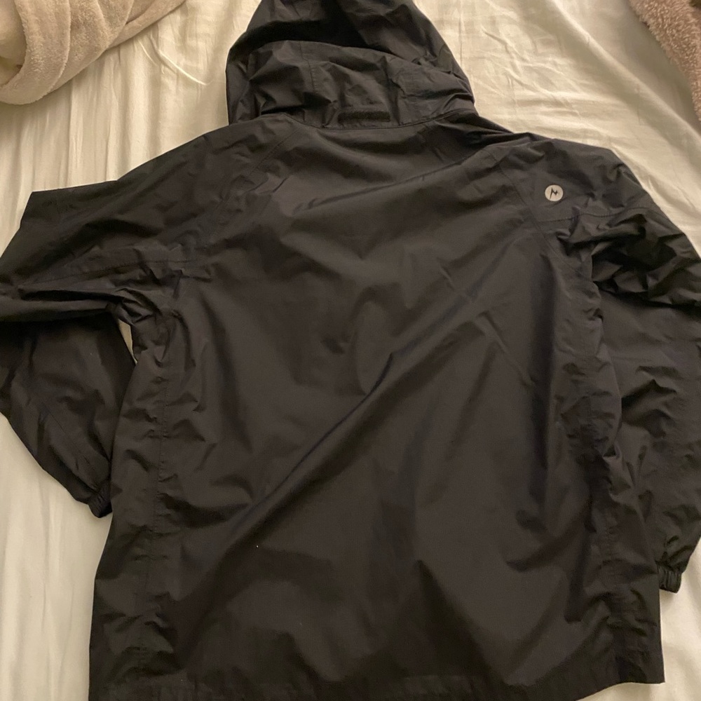 Marmot size youth XL black raincoat. Unisex. Zipper, velcro, and clasp. Hoodie